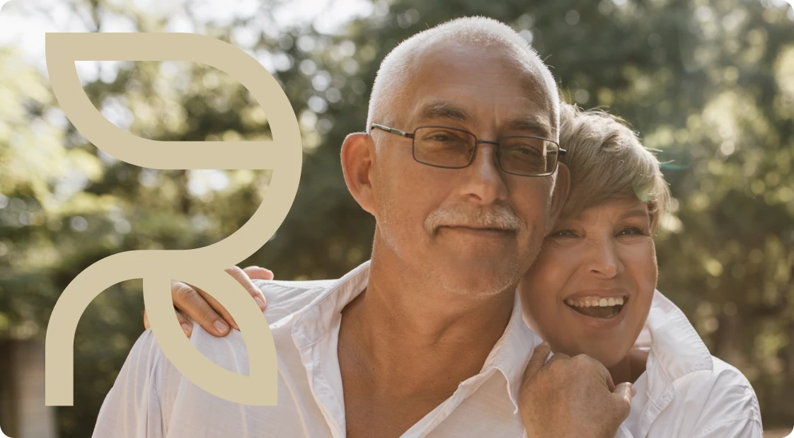 Smiling couple next to the Refreshify leaf mark